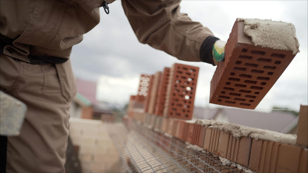 building a house with bricks