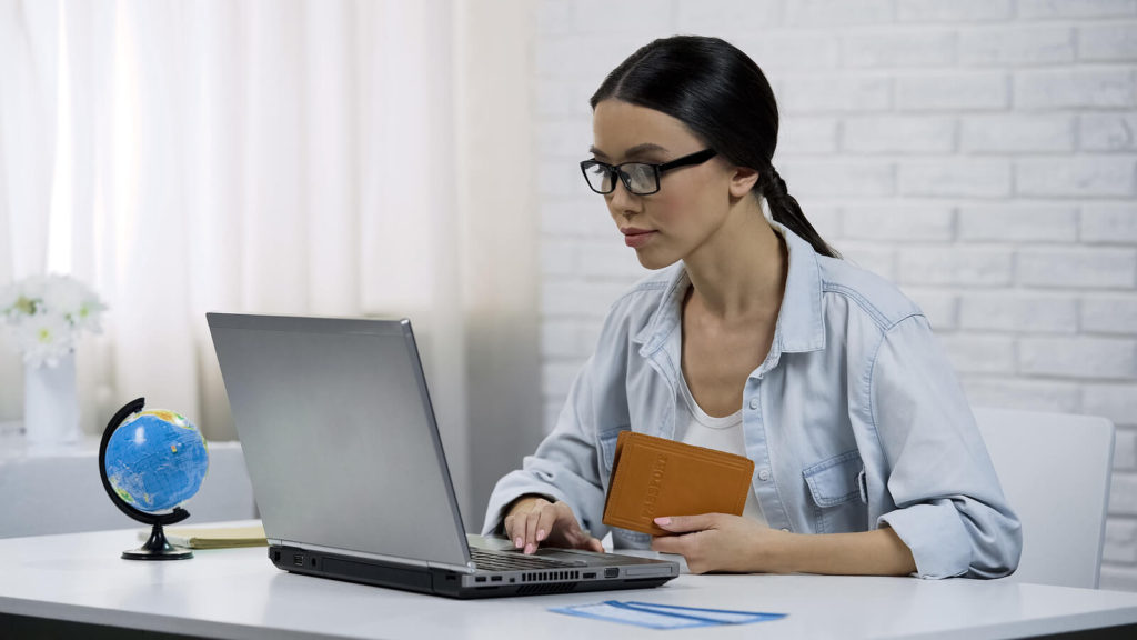 woman taking virtual tour on a computer