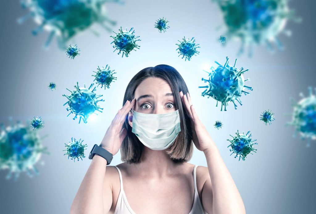 woman with mask and virus in the ari