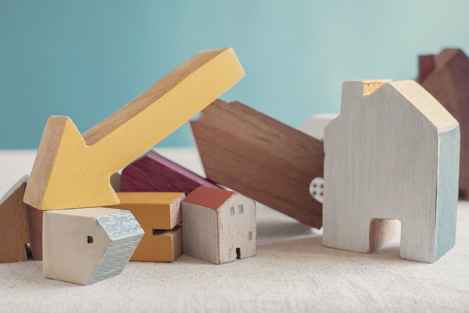 wooden houses falling over