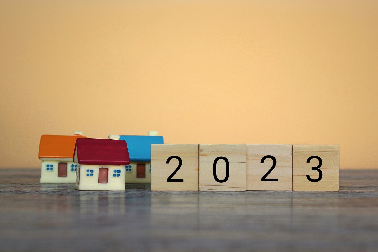 houses with 2023 in wooden blocks in front of them